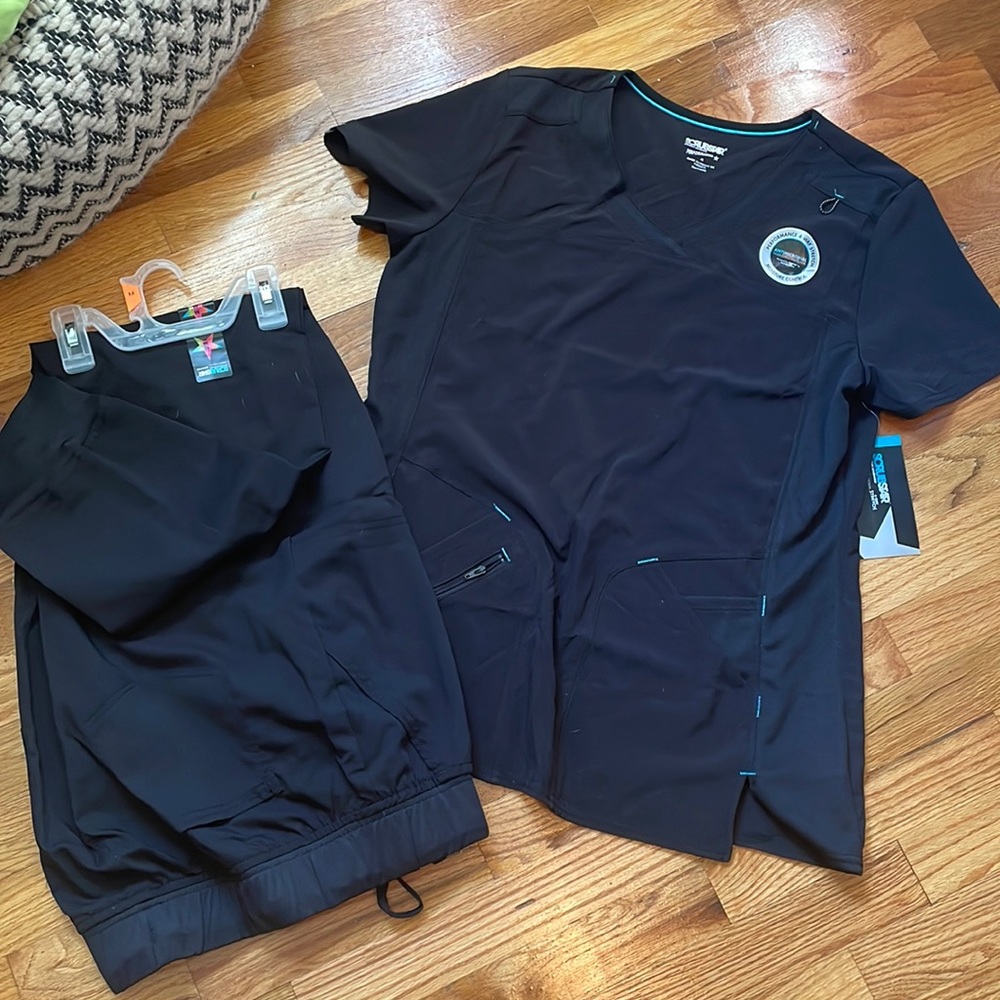 Scrubstar scrubs.. brand new. I have two tops and two sets of pants!